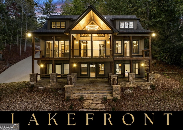 back of property featuring a patio area and a balcony