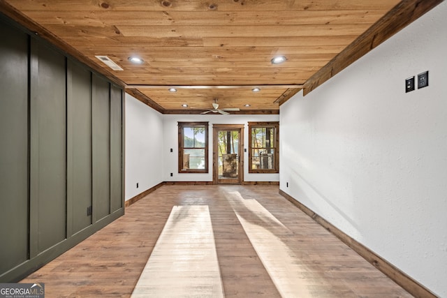 interior space featuring light wood-type flooring, ceiling fan, and wood ceiling