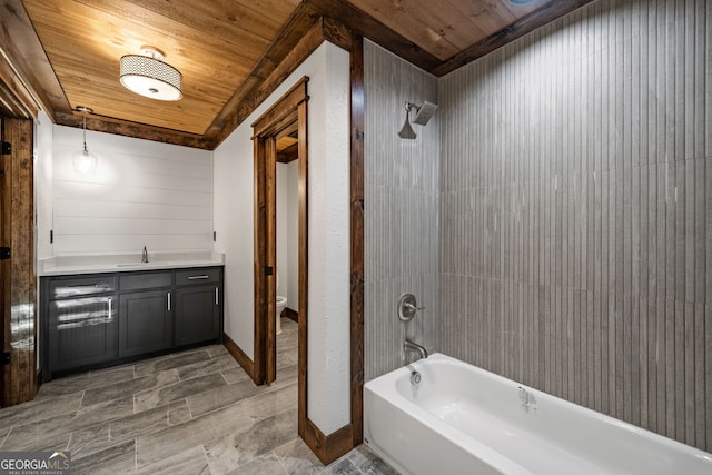 full bathroom featuring tiled shower / bath combo, vanity, wood ceiling, and toilet