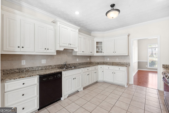 kitchen featuring ornamental molding, dishwasher, dark stone counters, and white cabinets