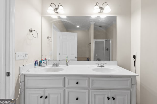 bathroom featuring vanity and an enclosed shower