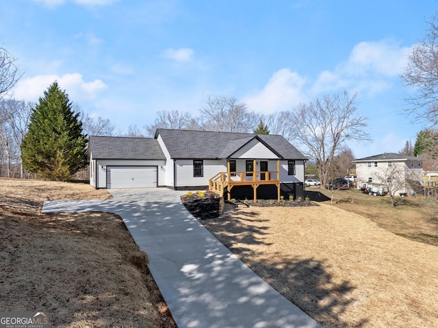 view of front of home with a garage and a deck