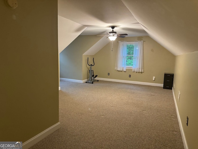 bonus room with ceiling fan, carpet flooring, and vaulted ceiling