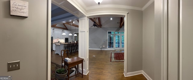 hallway featuring ornamental molding and dark hardwood / wood-style floors