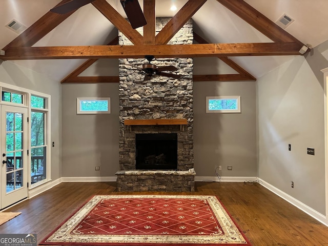 unfurnished living room with beam ceiling, dark hardwood / wood-style flooring, a fireplace, high vaulted ceiling, and ceiling fan