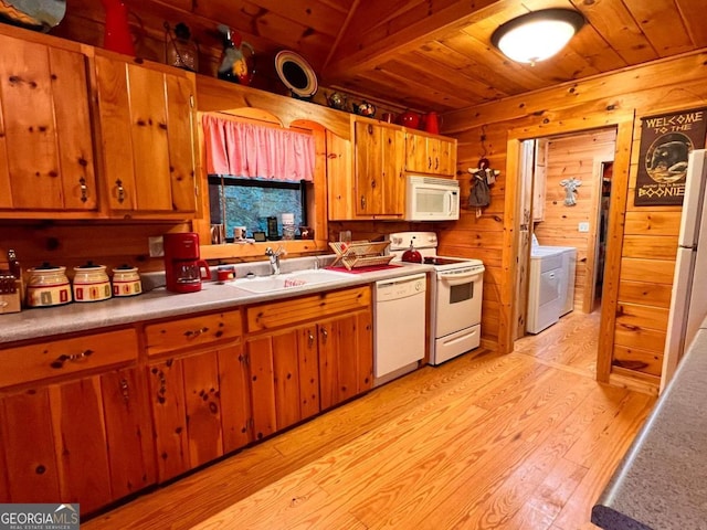 kitchen featuring washer / clothes dryer, wood ceiling, sink, light hardwood / wood-style floors, and white appliances