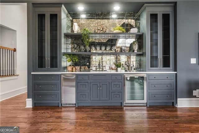 bar featuring gray cabinetry, wine cooler, sink, and dark hardwood / wood-style floors