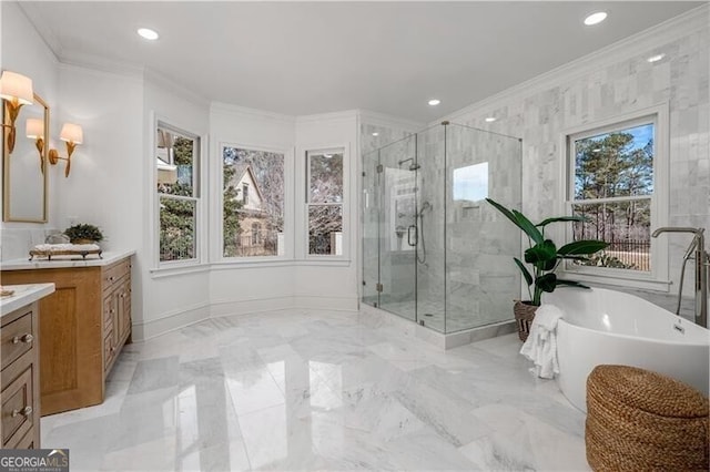 bathroom with vanity, crown molding, and independent shower and bath