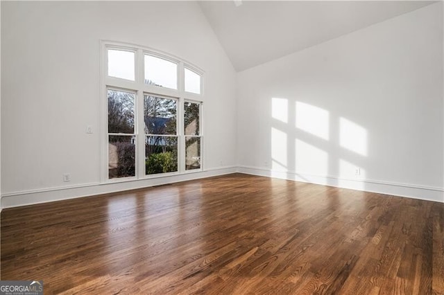 interior space with high vaulted ceiling and hardwood / wood-style floors