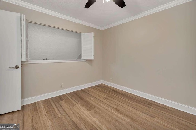 unfurnished room with ornamental molding, hardwood / wood-style flooring, and ceiling fan