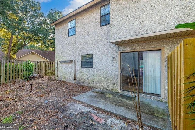 rear view of property featuring a patio