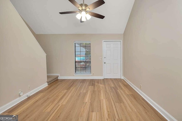 unfurnished living room with lofted ceiling, light hardwood / wood-style floors, and ceiling fan