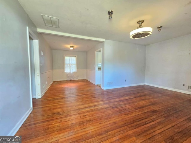 empty room featuring hardwood / wood-style floors