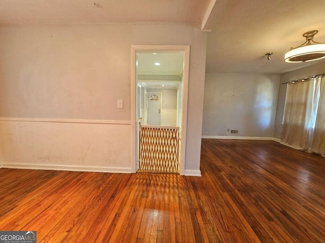 empty room featuring wood-type flooring