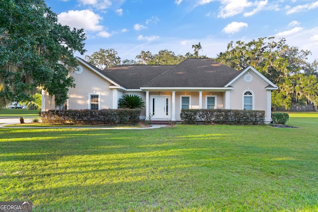 single story home featuring a front lawn