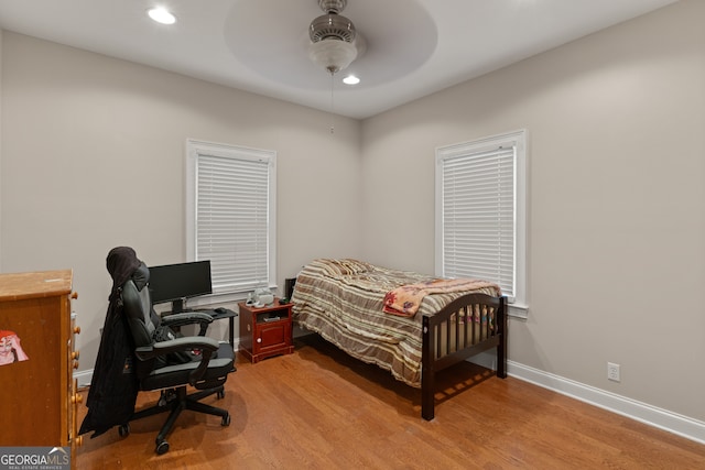 bedroom featuring light hardwood / wood-style flooring and ceiling fan