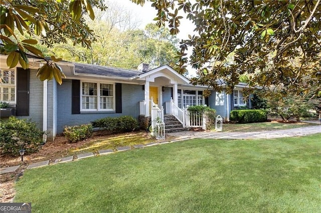 ranch-style house with a front lawn