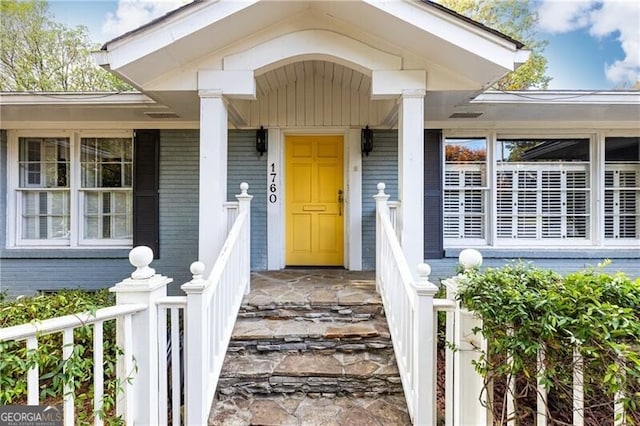 doorway to property featuring a porch