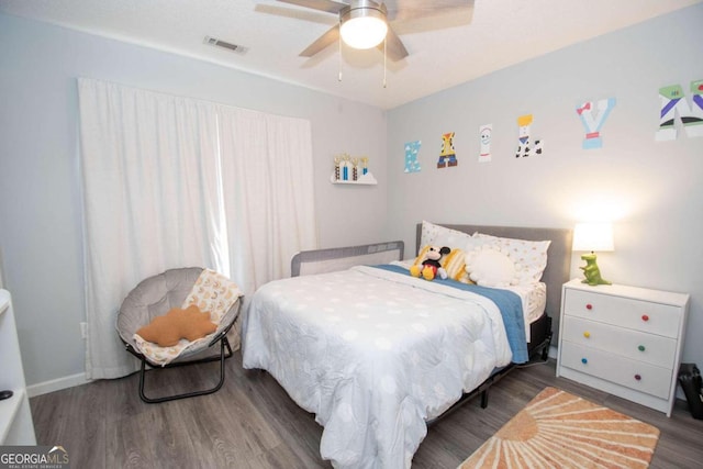 bedroom featuring dark wood-type flooring and ceiling fan