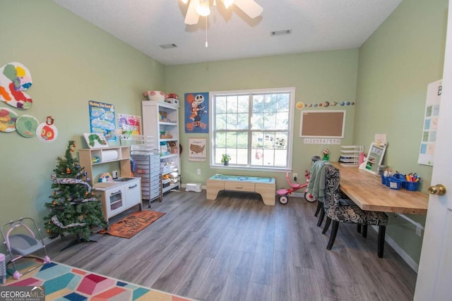 game room featuring hardwood / wood-style flooring and ceiling fan