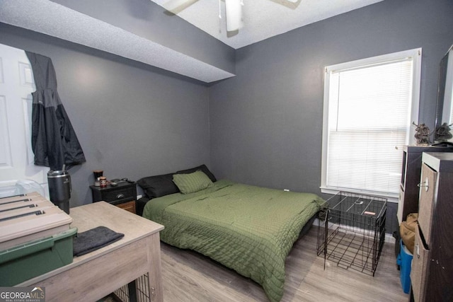 bedroom featuring light hardwood / wood-style flooring and ceiling fan