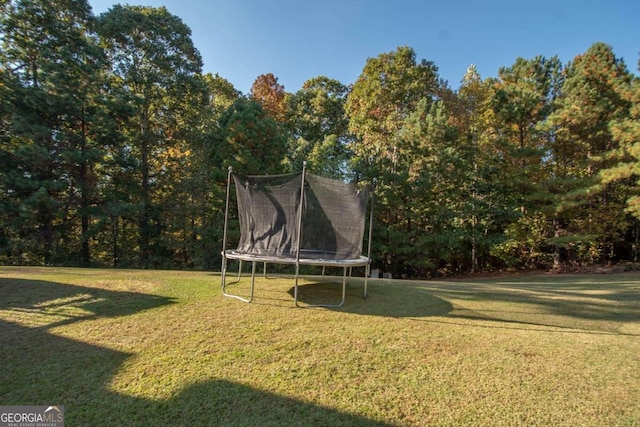 view of yard with a trampoline