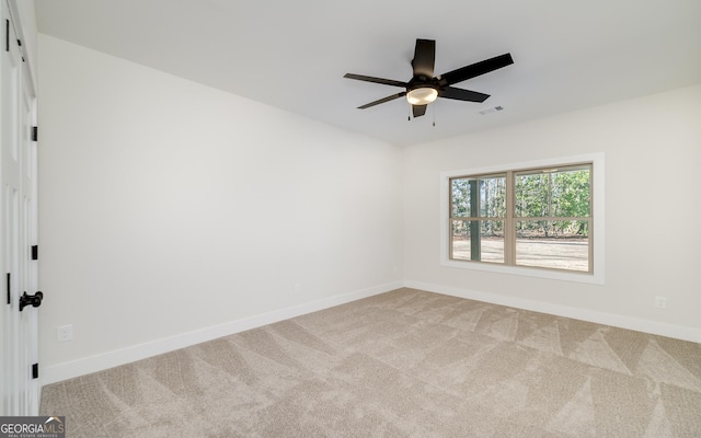 carpeted empty room with ceiling fan