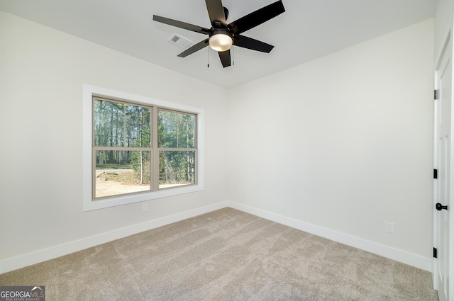 carpeted empty room with ceiling fan