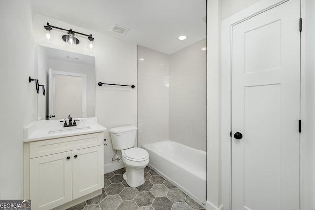 full bathroom featuring tub / shower combination, toilet, vanity, and tile patterned flooring