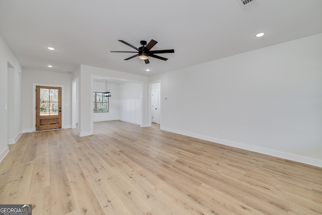 unfurnished living room with light hardwood / wood-style floors and ceiling fan