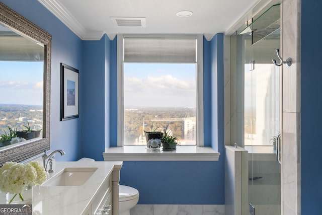 bathroom with toilet, visible vents, vanity, a stall shower, and crown molding