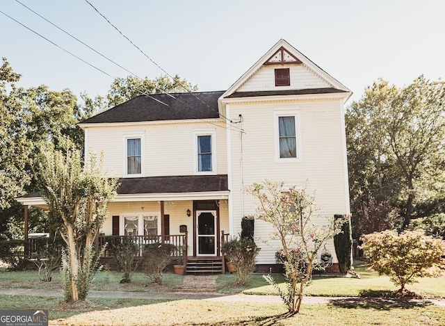 view of front facade with a porch and a front lawn