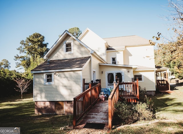 back of property featuring a lawn