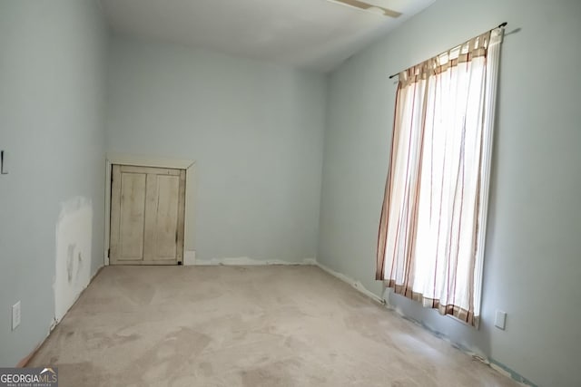 empty room with light colored carpet