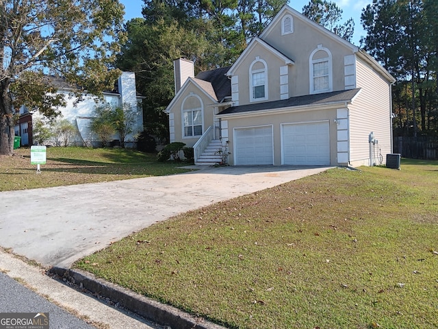 view of front property featuring a front yard and a garage