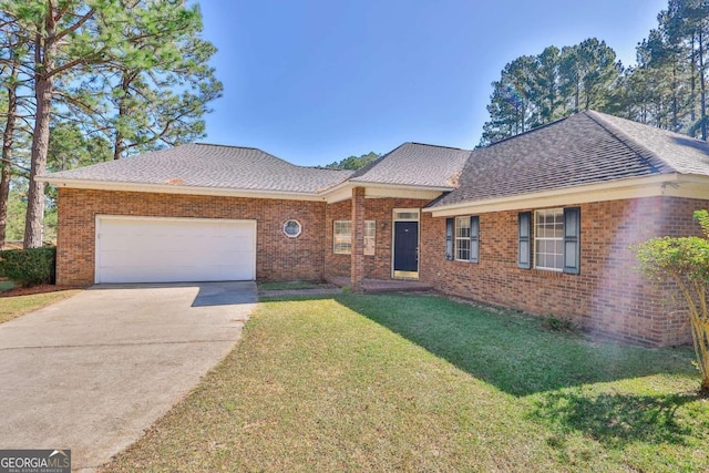 ranch-style home with a front lawn and a garage