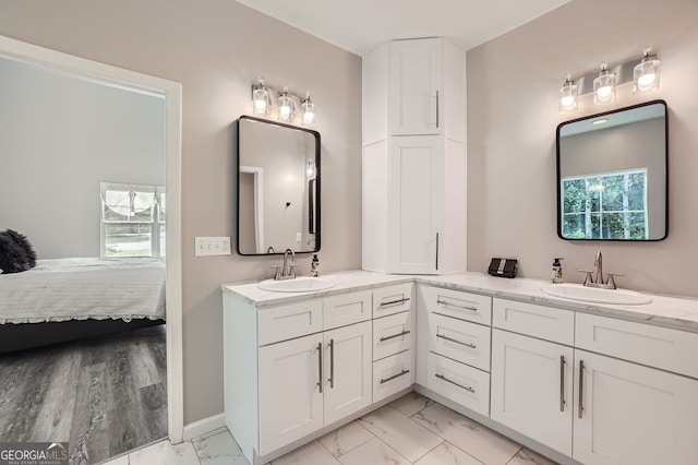 bathroom with vanity and hardwood / wood-style flooring