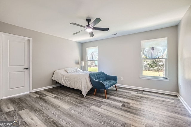 bedroom featuring hardwood / wood-style flooring and ceiling fan