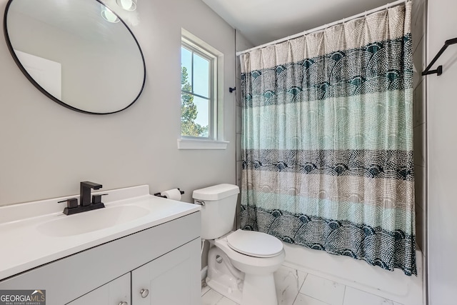 full bathroom featuring toilet, vanity, and shower / bath combination with curtain