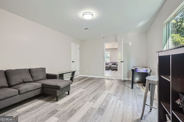 living room with light hardwood / wood-style flooring