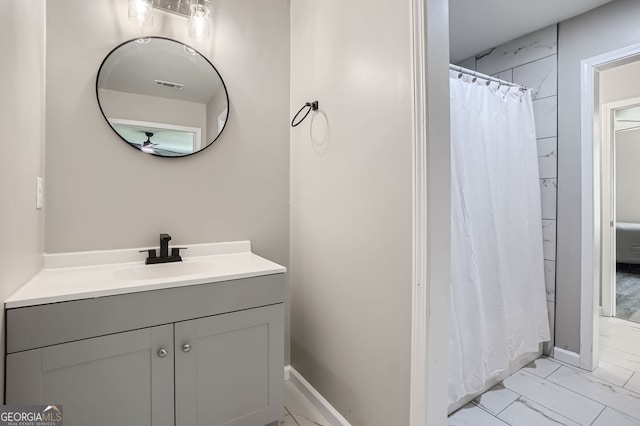 bathroom with a shower with shower curtain and vanity