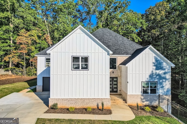 modern farmhouse style home featuring a garage