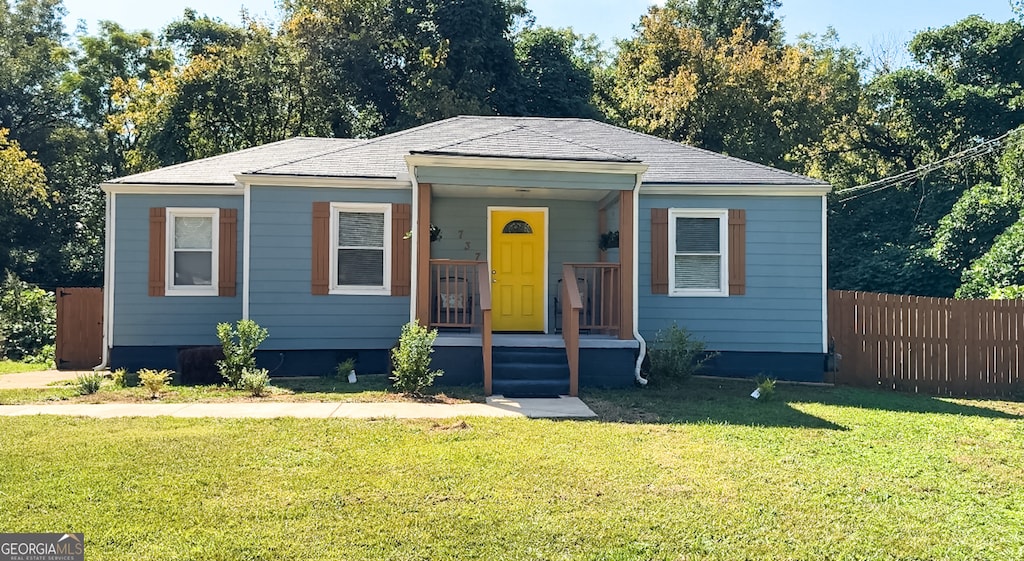 view of front of home featuring a front lawn and a porch