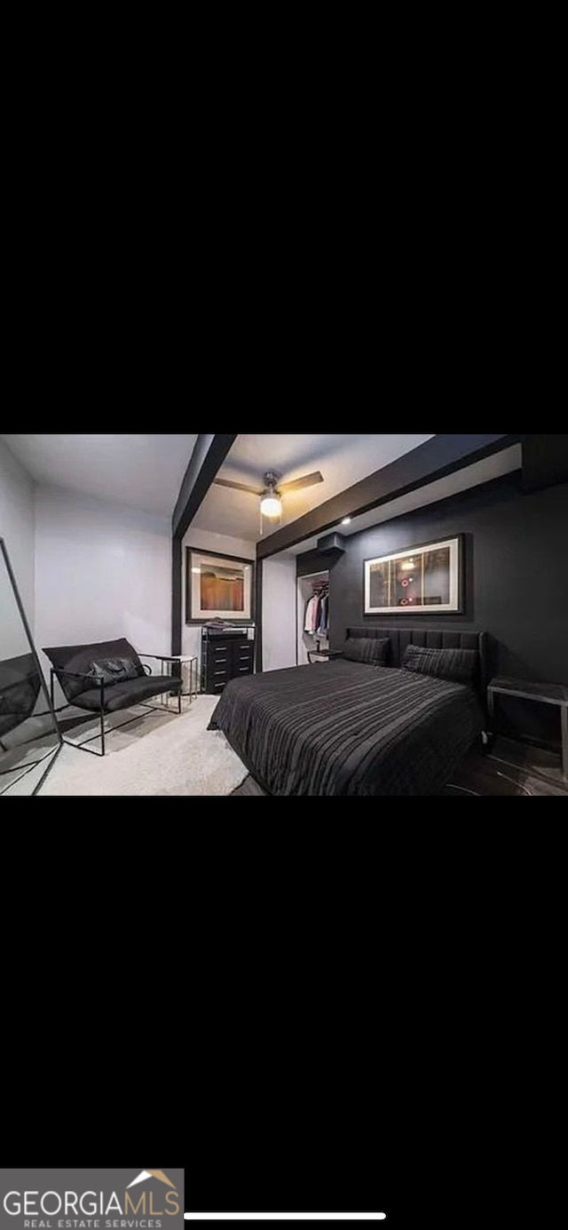 bedroom with beam ceiling