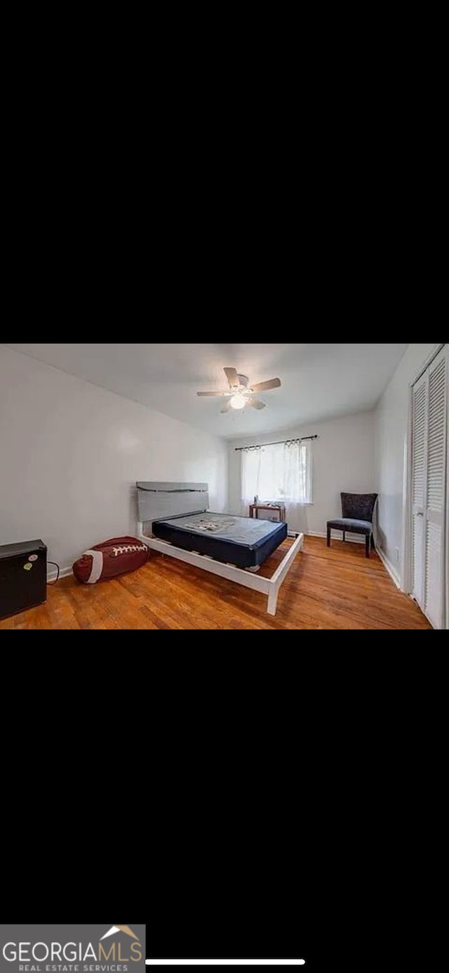 game room with ceiling fan and hardwood / wood-style flooring