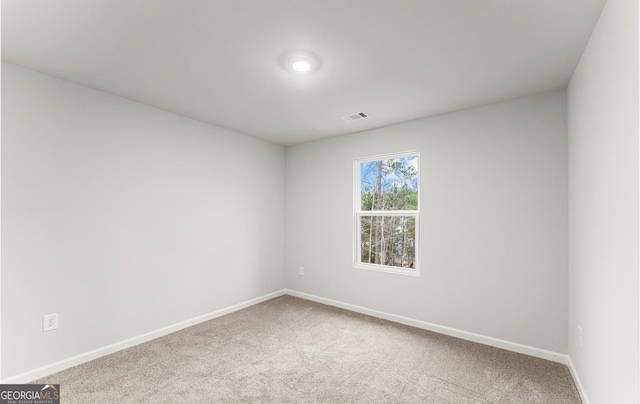 spare room featuring carpet floors