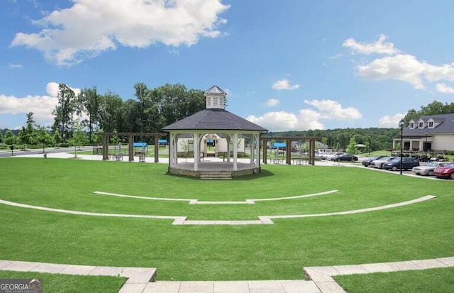 view of community with a gazebo and a lawn