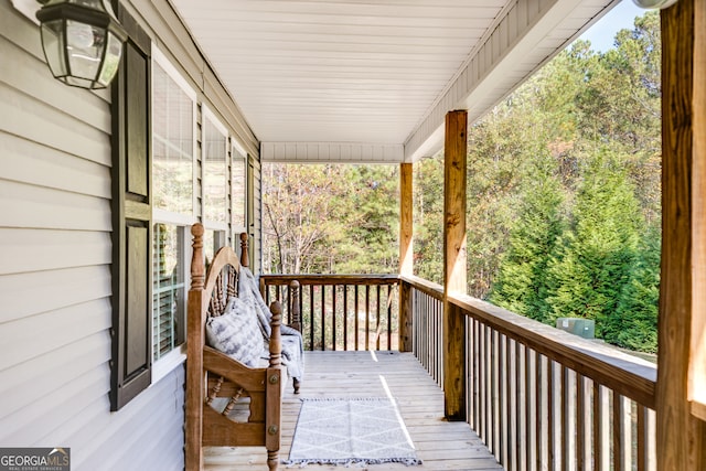 wooden deck featuring covered porch