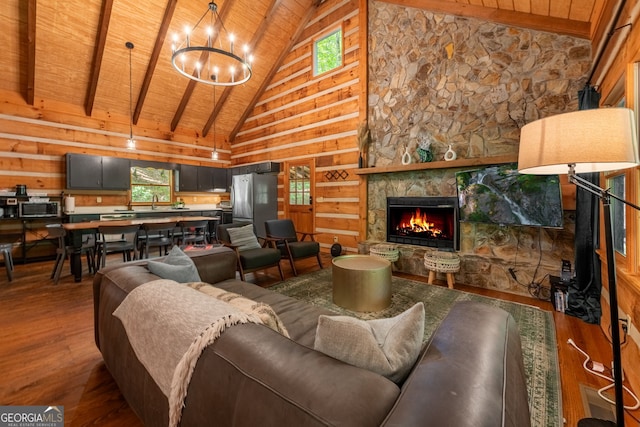 living room with a stone fireplace, high vaulted ceiling, wooden ceiling, beamed ceiling, and hardwood / wood-style floors