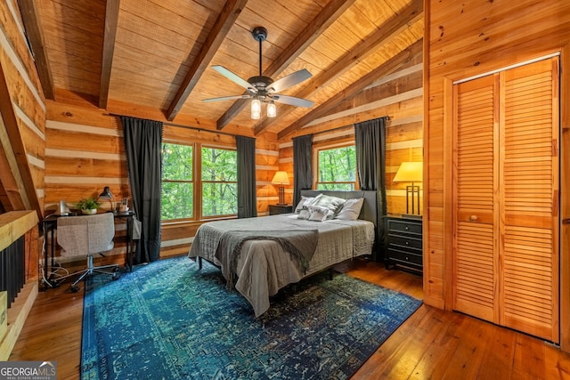 bedroom featuring dark wood-type flooring, wooden ceiling, and ceiling fan